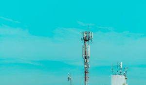Telecommunication tower with blue sky. Antenna on blue sky. Radio and satellite pole. Communication