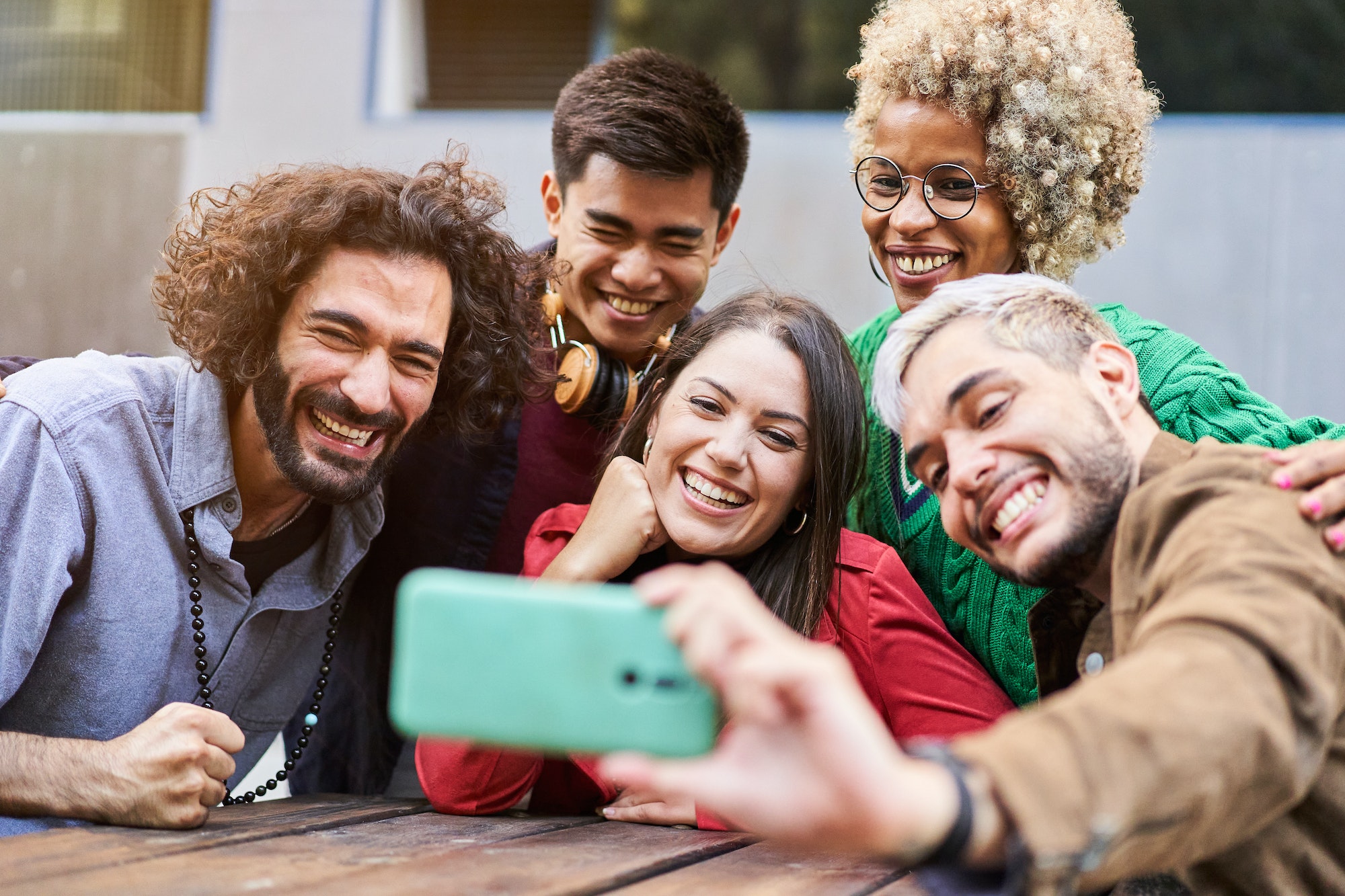 Happy multiracial friends having fun taking selfie - Young happy people together using smartphone